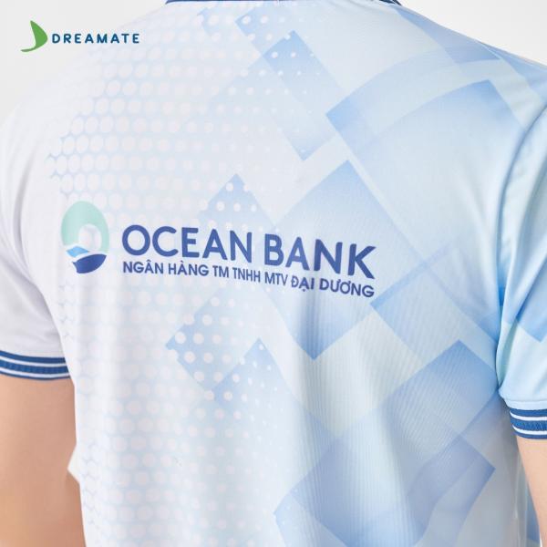 Áo đồng phục team building Oceanbank xanh trắng